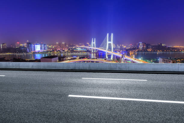 istock Empty highway and Nanpu bridge at night in Shanghai 1158550331