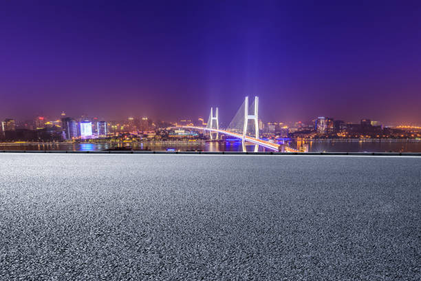 istock Empty road and Nanpu bridge at night in Shanghai 1158550432