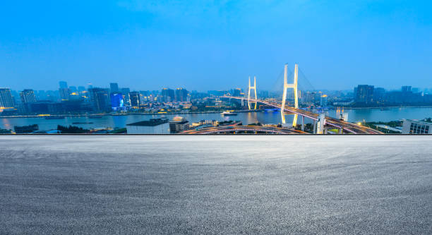 istock Empty road and Nanpu bridge at night in Shanghai 1158551271