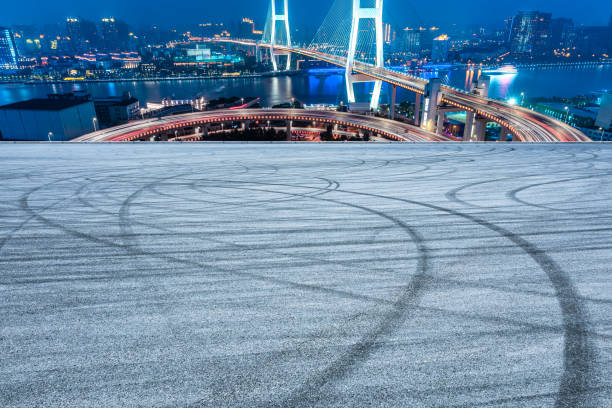 istock Empty road and Nanpu bridge at night in Shanghai 1158551403