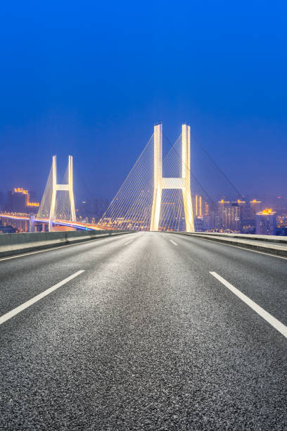 istock Empty highway and Nanpu bridge at night in Shanghai 1158551445