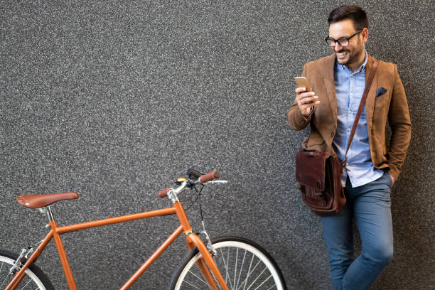 istock Happy businessman riding bicycle to work in morning 1158551461