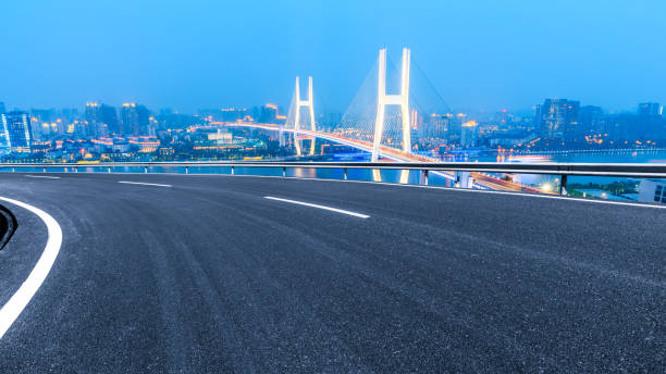 Empty highway and Nanpu bridge at night in Shanghai