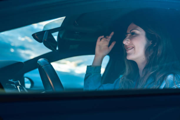 istock Young woman driving a car 1158555269