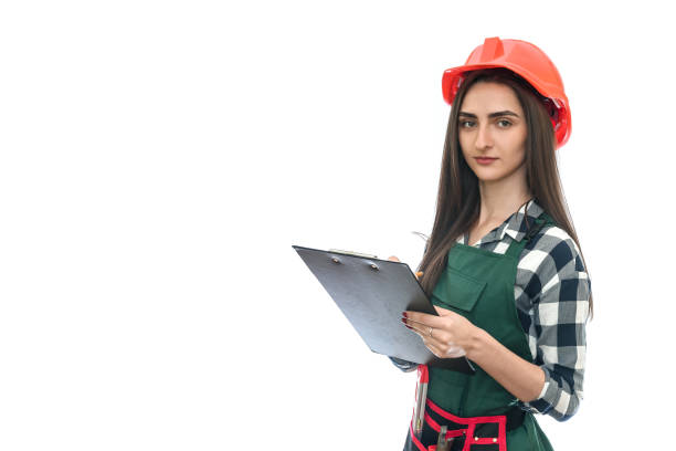 istock Woman in uniform with clipboard isolated on white 1158555411