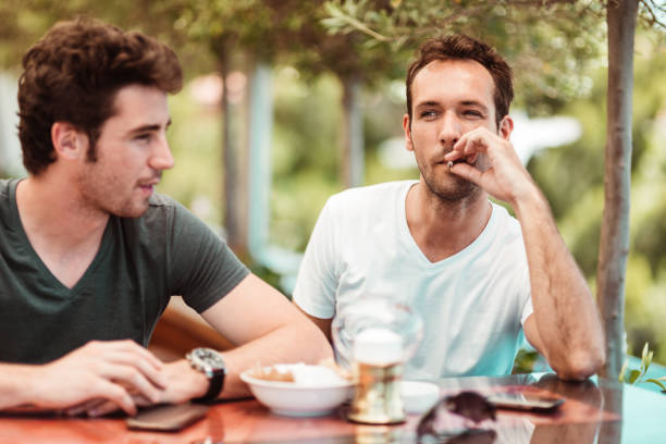 istock friends talking at the cafe together 1158556291
