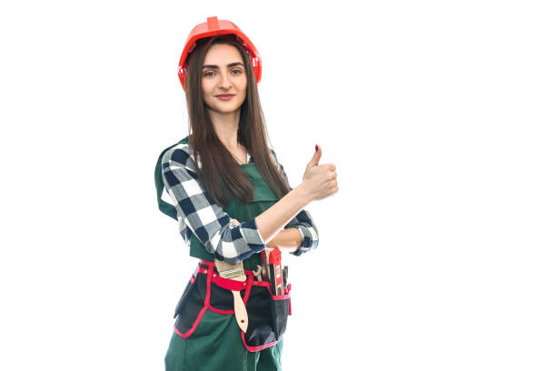 istock Woman in tool belt and coverall isolated on white 1158557012