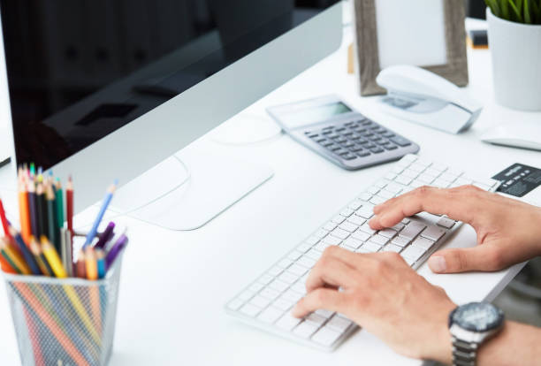 istock Businessman using computer keyboard. Close up of male hands typing on computer keyboard. Blogger, journalist writing new article. 1158559686