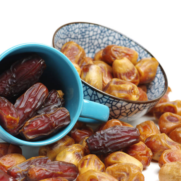 istock Delicious fresh organic dates on white background 1158562166