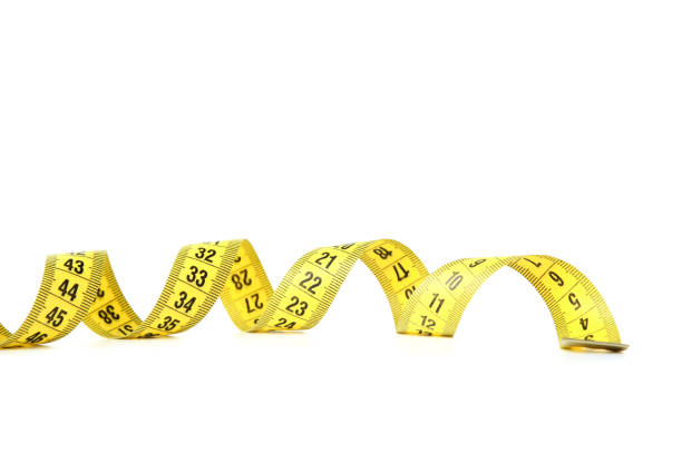 istock Yellow measuring tape isolated on white background 1158562859