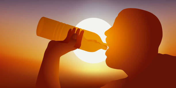 istock A sportsman drinks water from the bottle after running in the sun. 1158564928
