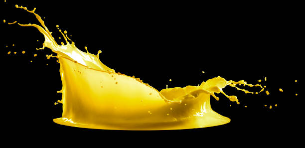 istock yellow paint splash isolated on black background 1158569904