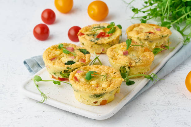 istock omelet with tomatoes and bacon, baked eggs with spinach and broccoli, closeup, keto, ketogenic diet 1158571436