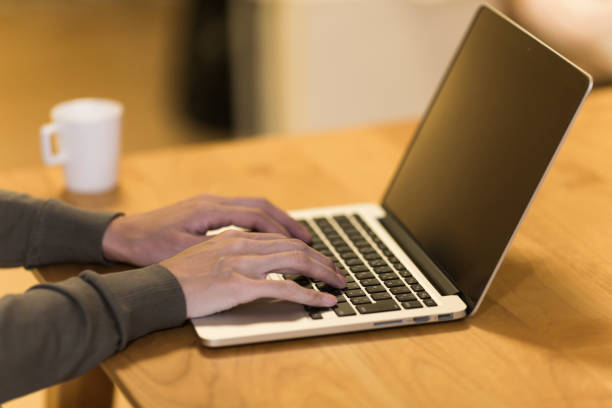 istock Woman operating a laptop 1158574165