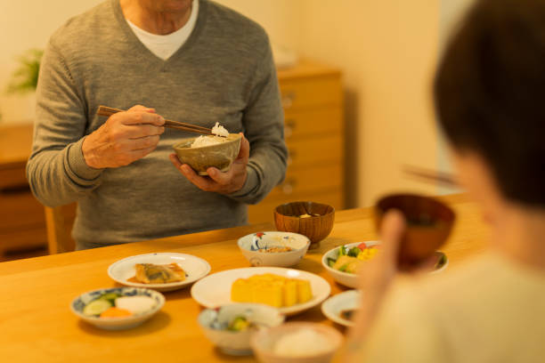 istock Senior couple eating dinner 1158574173