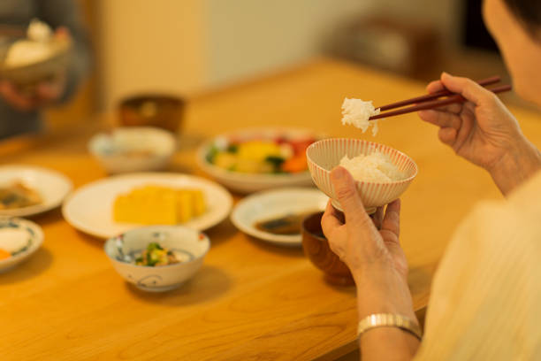 istock Senior couple eating dinner 1158574194