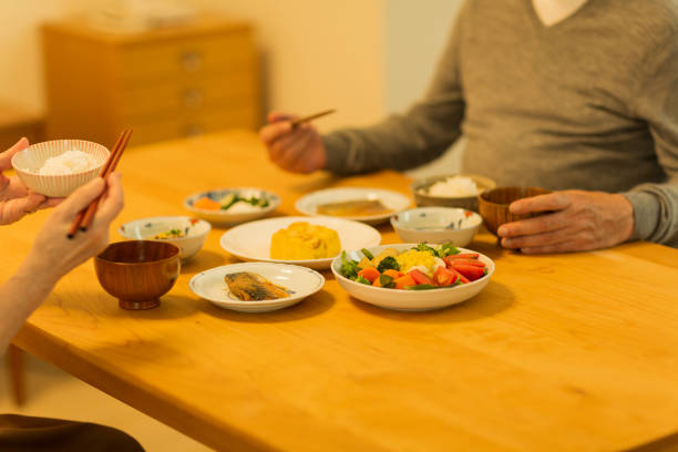 istock Senior couple eating dinner 1158574195