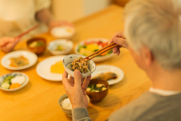 istock Senior man eating natto at dinner 1158574208