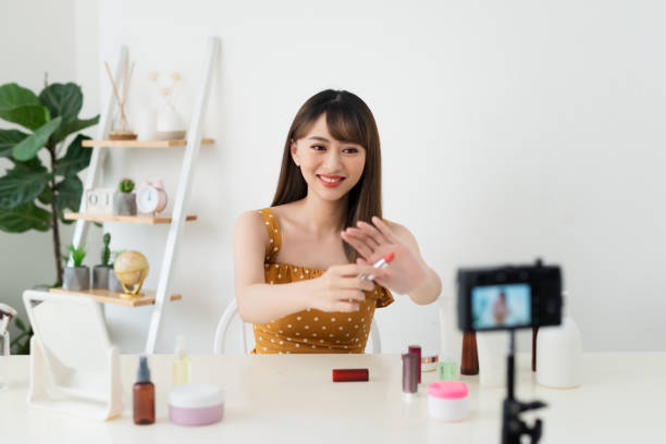 istock What is this. Pretty young woman sitting in front of the camera while testing cosmetics 1158574803