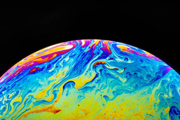 istock Macro shot of a soap bubble hemisphere. Abstract colorful liquid background. 1158576414