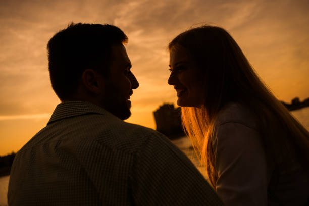 istock Loving couple in sunset 1158577122