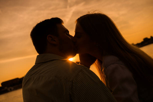 istock Loving couple in sunset 1158577125