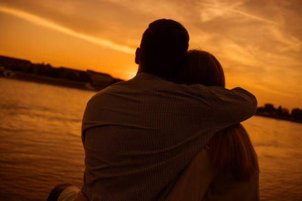istock Loving couple in sunset 1158577282