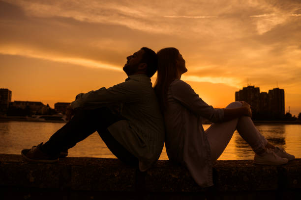 istock Loving couple in sunset 1158577368