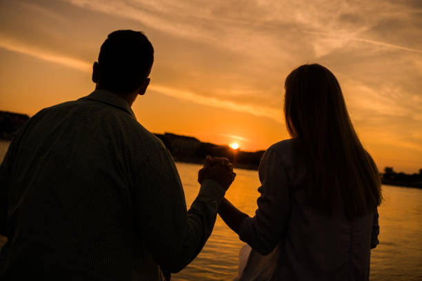 istock Loving couple in sunset 1158577481