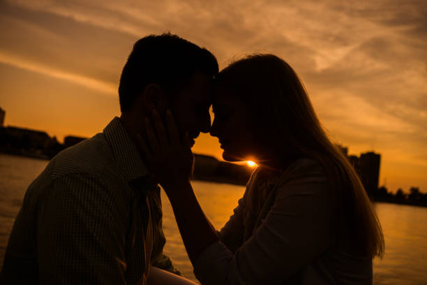 istock Loving couple in sunset 1158578195