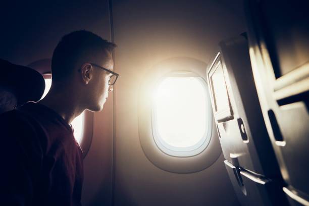 istock Man traveling by airplane 1158578382
