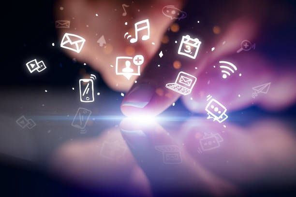 istock Finger touching tablet with hologram app icons above 1158580698