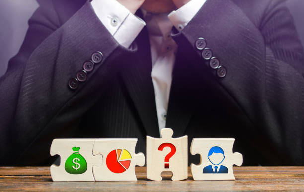 istock A businessman sits in despair because he is unable to set up a business processes. missing element. Wrong business model, unprofitability, inefficiency. Failed project. Young inexperienced businessman 1158581990