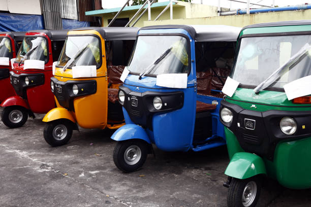 Colorful tricycles used as public transportation are parked at a public parking area. ANTIPOLO CITY, PHILIPPINES – JUNE 25, 2019: Colorful tricycles used as public transportation are parked at a public parking area. philippines tricycle stock pictures, royalty-free photos & images