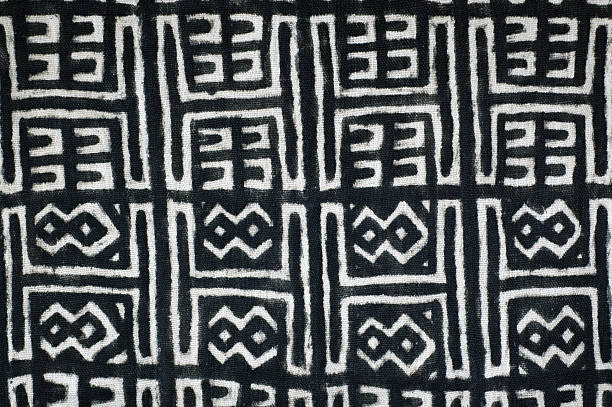 mudcloth Mudcloth. Woven in narrow bands which are sewn together into wider pieces and then dyed with iron rich mud. Mali, Africa. woven fabric photos stock pictures, royalty-free photos & images