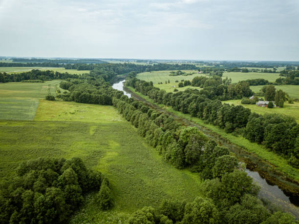 istock country river in green forest. drone aerial image 1158597723