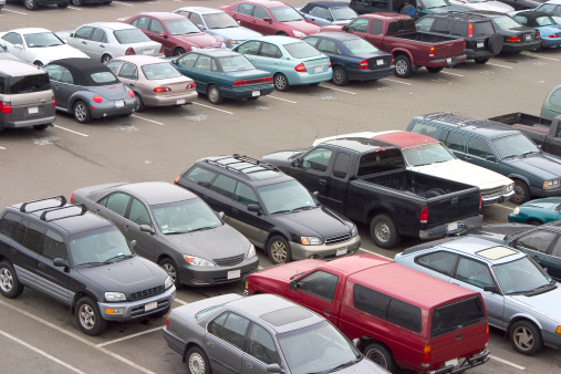 A parking lot crammed with cars. All trademarks have been removed.
