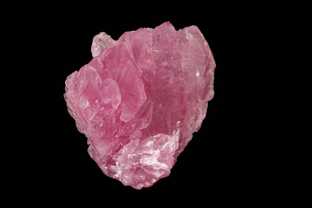 istock Macro pink quartz mineral stone on black background 1158599062