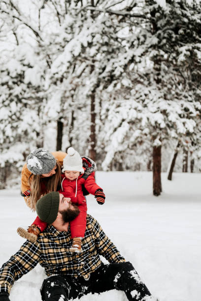 istock Let's cover up dad with snow 1158599585
