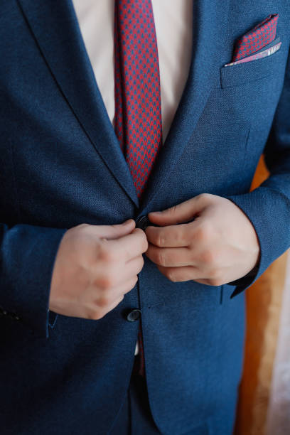 istock A man and a successful businessman straightens his jacket 1158600839