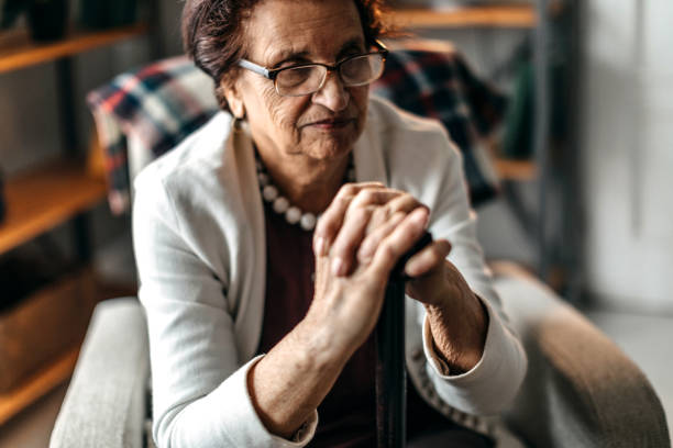 istock Old woman sitting alone 1158600989