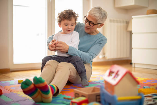 istock Grandmother playing with her grandson 1158601104