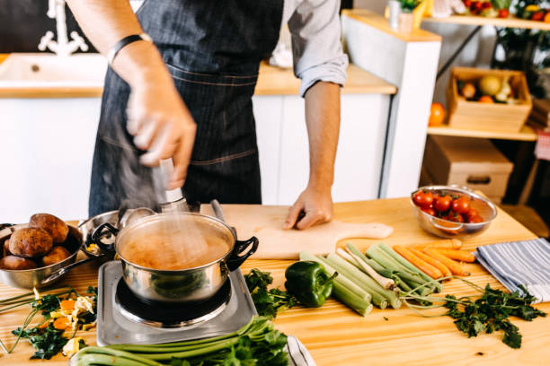 istock Man mixing food 1158602331