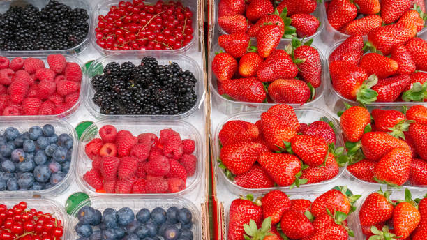 istock Fresh strawberries, blueberries, currants and raspberries. 1158602512