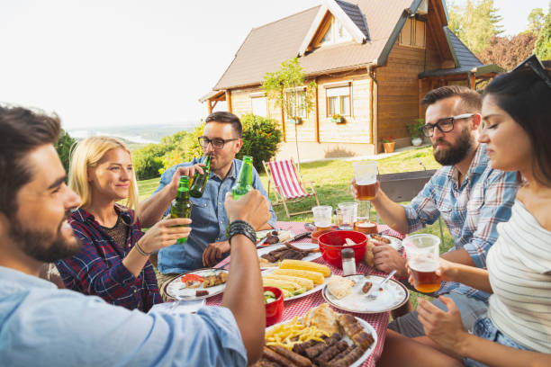 istock Friends drinking beer at barbecue party 1158603681
