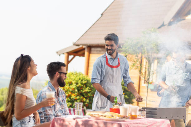 istock Friends having a barbecue party 1158603800