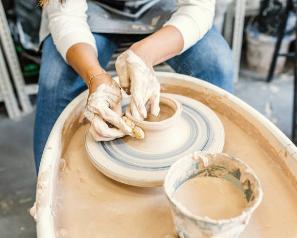 istock Woman works at potter's wheel 1158604159