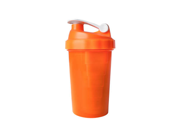 bright orange modern shaker for sports nutrition isolated - body building milk shake protein drink drink imagens e fotografias de stock
