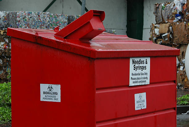 red dumpster for biohazard disposal at recycling center