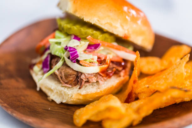 istock BBQ pulled pork sandwich in shape of small sliders with brioche buns. 1158607902